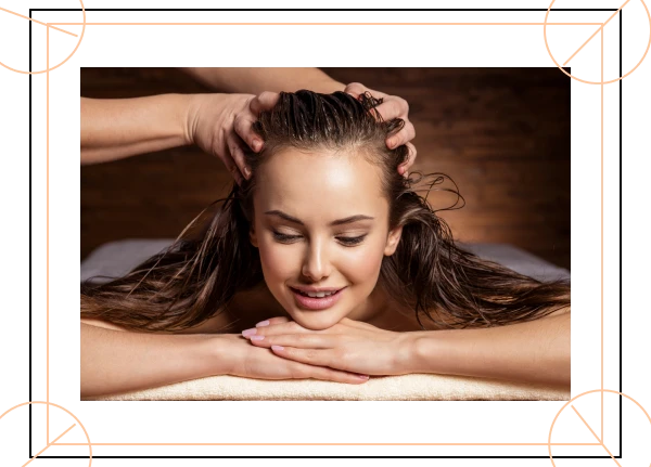 head massage therapy on smiling woman